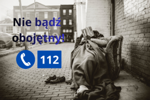 na zdjęciu czarno białym osoba leżąca na ulicy i grafika z napisem nie bądź obojętny i numerem telefonu 112
