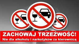 Baner pokazuje znak zakazu w tle znaku przekreślony samochód osobowy i kieliszek. pod znakiem napis o treści &quot;Zachowaj trzeźwość. Nie dla alkoholi i narkotyków za kierownicą&quot;